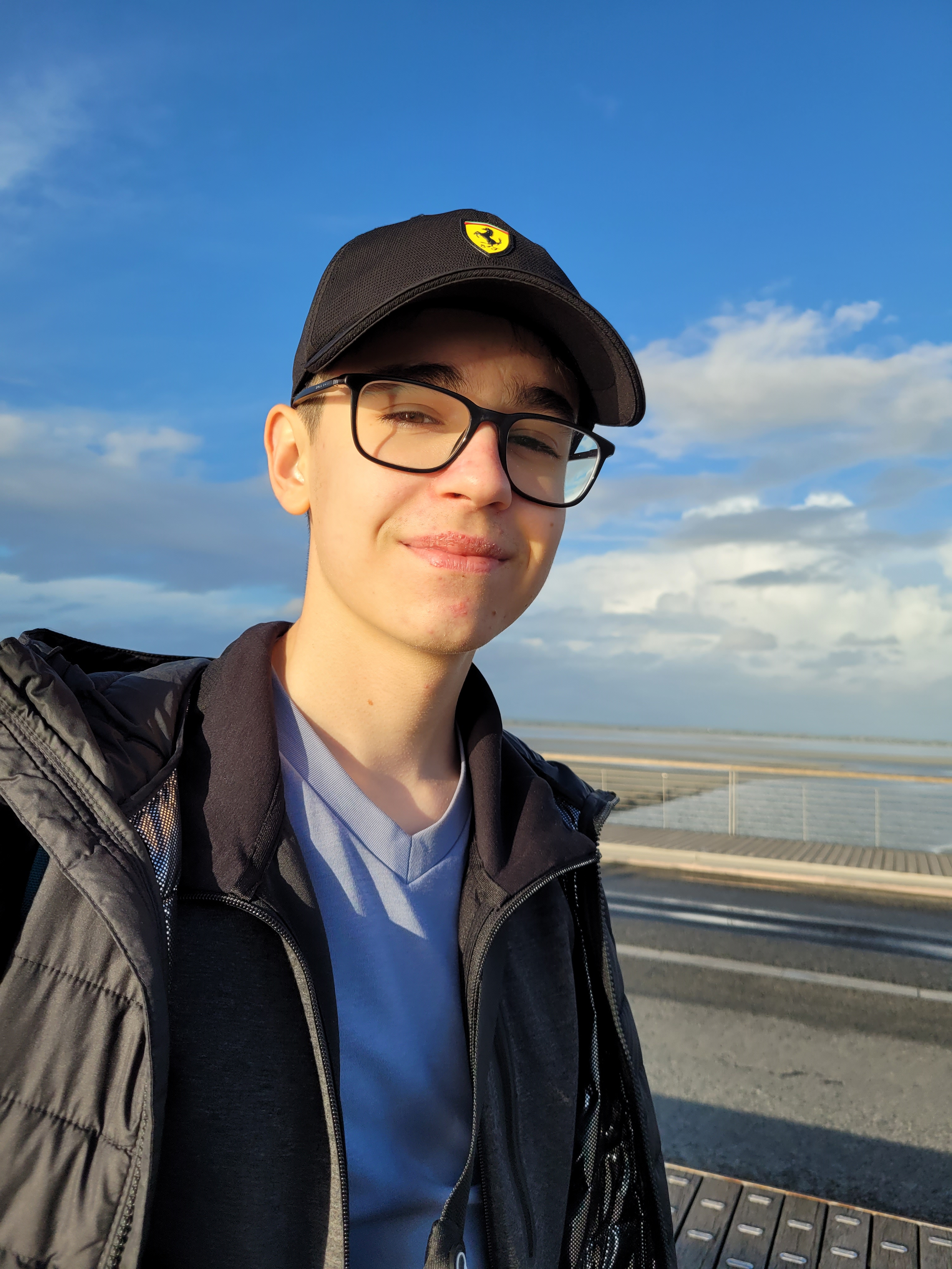 Me with a beatiful smile, being blinded by the sun and wearing a ferrari cap. 
        Taken besides the Mont Saint-Michel